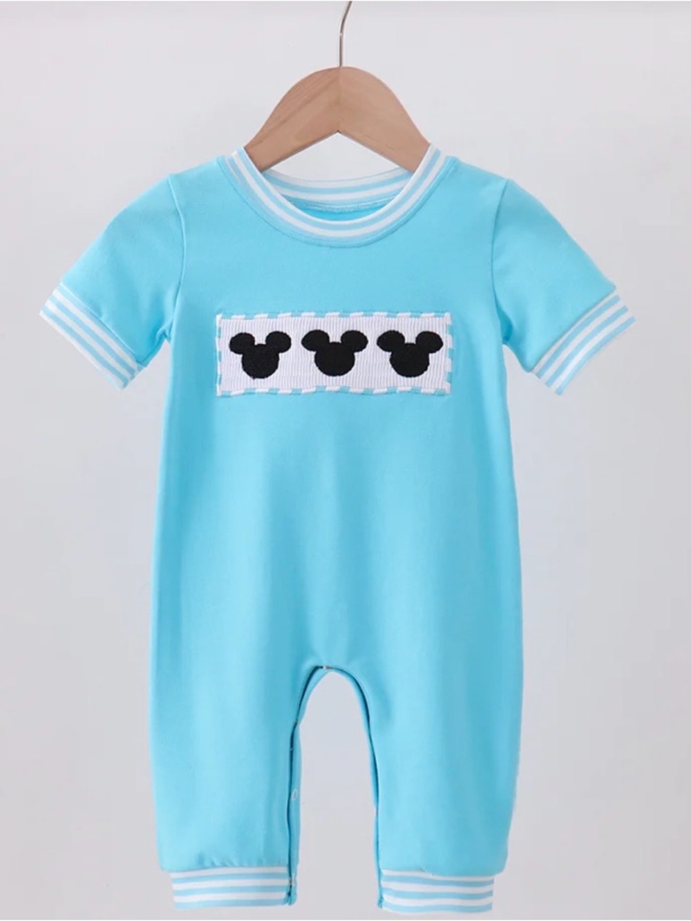 Honeydew USA Light Blue Short-Sleeve Baby One-Piece with Black Character Patch